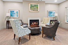 Decatur apartment for rent - A living room with a fireplace and three chairs.