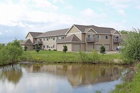 Fond Du Lac apartment for rent - a large house sitting next to a body of water