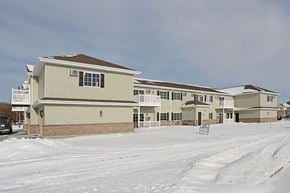 Oconto apartment for rent - a row of houses on a snow covered street