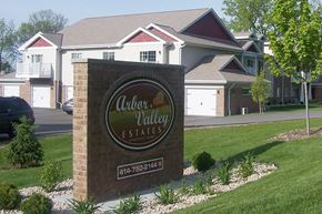 Hartland apartment for rent - a sign in front of a subdivision with houses