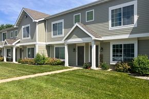 Clear Lake apartment for rent - A row of houses with green lawns in front.