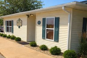 Galesburg apartment for rent - A small building with a sign on the front door.