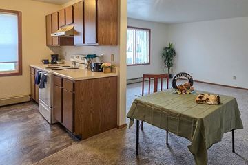 Shawano apartment for rent - A kitchen with a table and chairs in the living room.