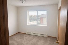 Osceola apartment for rent - A room with a window and a carpeted floor.