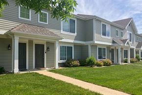Clear Lake apartment for rent - A row of houses with green lawns in front.