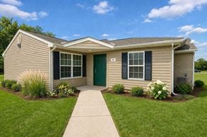 Tulsa apartment for rent - A small house with a green door and a grey roof.