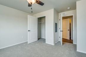 Sturgeon Bay apartment for rent - an empty bedroom with a closet and a ceiling fan
