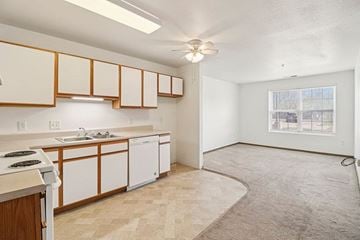Lawrence apartment for rent - A kitchen with white cabinets and a window.