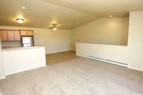 Appleton apartment for rent - an empty room with a kitchen and a carpet floor