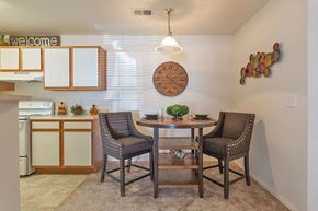 Garden City apartment for rent - A dining room with a round table and chairs.