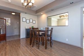 Liberal apartment for rent - a dining room with a table and chairs