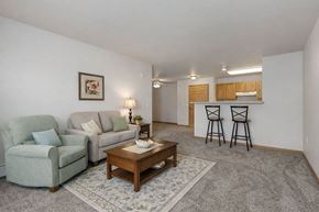 Oshkosh townhouse for rent - A living room with a couch, chair, and coffee table.