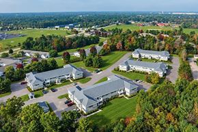 Wisconsin Rapids apartment for rent - A bird's eye view of a large building surrounded by trees.