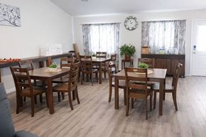 Liberal apartment for rent - A dining room with a large table and chairs.