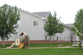 Mitchell apartment for rent - a playground in a yard in front of a house