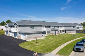 Horicon apartment for rent - a large white house with a yard and cars parked in a driveway
