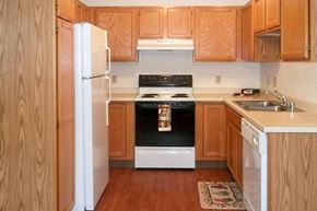 Wisconsin Rapids apartment for rent - a kitchen with a stove and a refrigerator