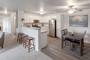 Merrill apartment for rent - a kitchen and dining room with a table and chairs