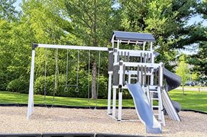 Wisconsin Rapids apartment for rent - A playground with a slide and a swing set.
