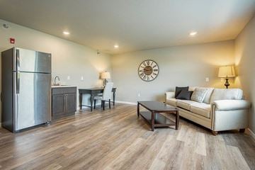 Onalaska apartment for rent - a living room with a couch and a refrigerator