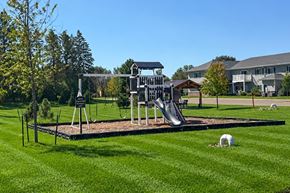 New Richmond apartment for rent - A playground with a slide and a swing set.