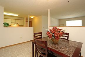 Green Bay apartment for rent - a dining room table with a vase of flowers