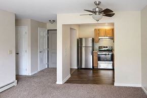 Port Huron apartment for rent - A kitchen with a refrigerator, oven, and microwave.