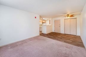 Creston apartment for rent - A room with a ceiling fan and a fire extinguisher on the wall.