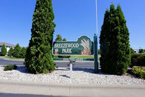 Neenah apartment for rent - a sign for brewerswood park on the side of the street