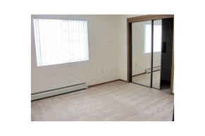 Neenah apartment for rent - an empty room with a window and a mirror