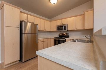 Horicon apartment for rent - a kitchen with stainless steel appliances and white counter tops