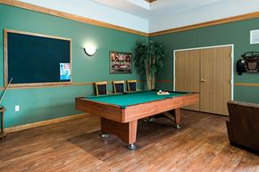 Milwaukee apartment for rent - A pool table in a room with green walls.