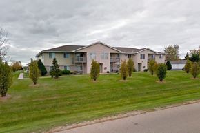 Greenville apartment for rent - an apartment building on the side of a grass field