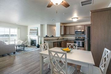 Harrison apartment for rent - a kitchen and living room with a table and chairs