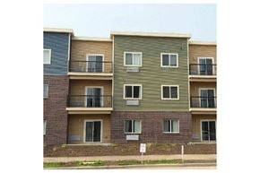 Viroqua apartment for rent - the facade of a building with windows and balconies