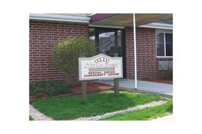 Fitchburg apartment for rent - A sign in front of a building that says "Odd Fellows Home & Community Center Rental Office".
