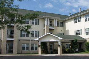 South Milwaukee apartment for rent - A large apartment complex with a covered walkway.