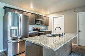 Onalaska apartment for rent - a kitchen with stainless steel appliances and a granite counter top