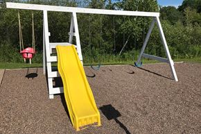 Ladysmith apartment for rent - a swing set with a yellow slide on it