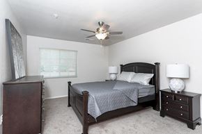 Waterford apartment for rent - a bedroom with a bed and a ceiling fan