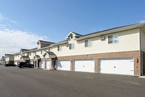 Little Chute apartment for rent - a row of houses with white garage doors