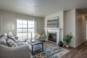 Harrison apartment for rent - a living room with a fireplace and a couch
