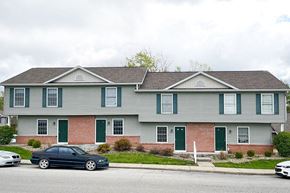 Gosport apartment for rent - a house with cars parked in front of it