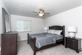 Waterford apartment for rent - A bedroom with a bed, nightstand, and dresser.