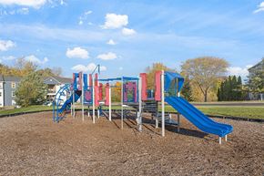 Peoria apartment for rent - a childrens playground with slides in a park