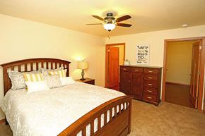 Hartland apartment for rent - a bedroom with a bed and a ceiling fan