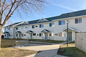 Marshall apartment for rent - a row of white houses on the side of a sidewalk
