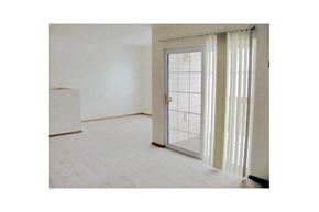 Neenah apartment for rent - an empty living room with a glass door