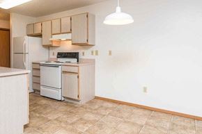 Mitchell apartment for rent - a kitchen with a stove and a refrigerator