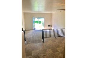 Appleton apartment for rent - an empty living room with a railing